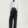 Asymmetrisk skjorte i poplin med pailletter Asymmetrisk skjorte i poplin med pailletter
