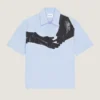 Skjorte i poplin med surrealistisk print Skjorte i poplin med surrealistisk print