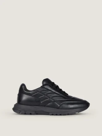 Sneakers i skinnende polstret læder